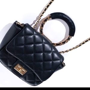 The Callie Full Circle Quilted Top Handle Hang Bag Crossbody black color